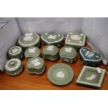 Collection of Wedgwood green and spinach Jasper ware to include boxes and covers, and dishes.  (12)