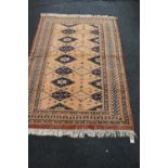 Turkish rug on beige ground, 170cm x 122cm.