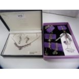 Silver and amethyst necklace, a pair of matching earrings and a group of modern silver chains with