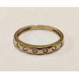 9ct gold ring set with pink stones, 1.8g gross.