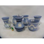 Group of Wedgwood blue Jasper ware to include a pair of milk jugs, pair of vases with spreaders,