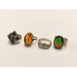 Group of 925 silver rings to include a ring set with amber-coloured stone, black opal-style ring,