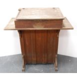 Vintage child's school desk with integral inkwells.