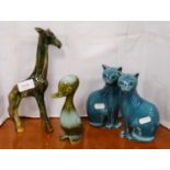 Two Poole Pottery blue glazed models of cats, similar glazed model of a duck and a Devon model of