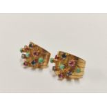 Pair of Indian style yellow metal and gem-set earrings.