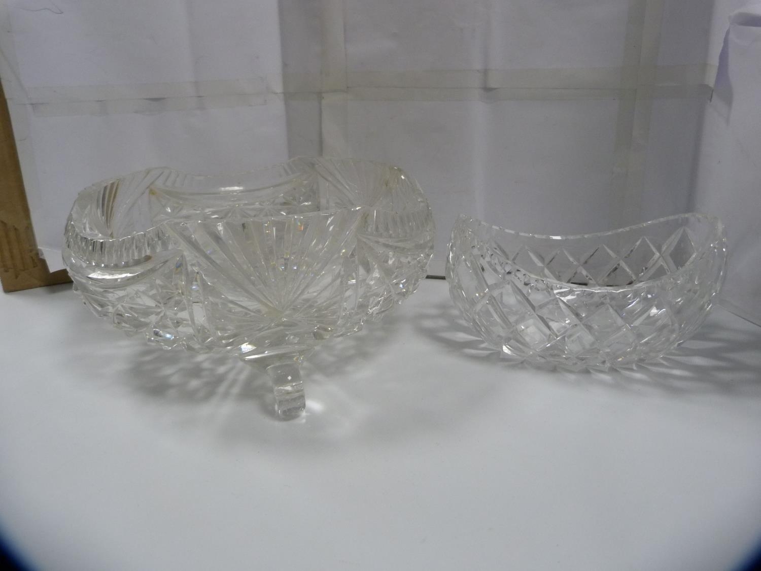 Cut glass bowl on tripod feet and a boat-shaped bowl.  (2)