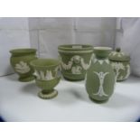 Five pieces of Wedgwood green Jasper ware to include a small planter, three spill vases and a