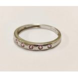 9ct white gold half hoop eternity ring set with pink stones, 1.9g gross.