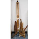 Group of wooden picture easels to include a floor-standing adjustable easel.