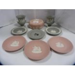 Group of Wedgwood Jasper ware to include pink circular jar and cover, three pink circular pin dishes