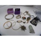 Assorted jewellery to include a silver and opal brooch, silver rings, celtic-style bangle, modern