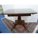 19th century satinwood-strung mahogany tea table with a rosewood top, on gilt metal animal paw