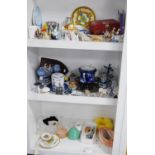 Delft-style windmill ornaments, oriental sake set, ornaments etc (three shelves).