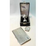 Double-ended spirits measure, 'Sterling Silver', cased, a silver cigarette case and a vesta case.