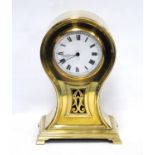 Edwardian brass-cased mantel clock of balloon shape, the white enamel dial with Roman numerals above