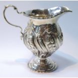 Silver cream jug of 18th century embossed baluster shape, by Adie Brothers, Birmingham 1922, 160g or