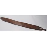Aboriginal fish tail paddle club (Rainforest sword), with shaped grip, 147.5cm long and 13.5cm wide.