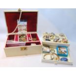 Various earrings and items in two jewellery boxes.