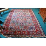 Bakhtiari hand-knotted rug decorated with nine rows of five geometric and floral squares, with a