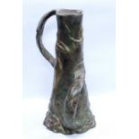 Art Nouveau twin-handled pewter jug decorated with nude figures amongst the reeds, 32cm high.