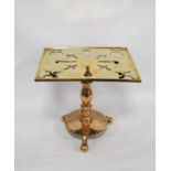 Georgian brass trivet with a square pierced top, on turned column, circular base and tripod ball