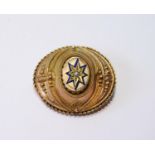 Victorian gold oval brooch with pearl-set enamel star, 38mm, 10g gross.