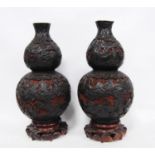 Pair of 20th century Chinese red and black double gourd cinnabar lacquer vases decorated with