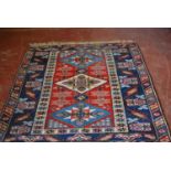 Turkish Dosemealti hand-knotted rug decorated with three geometric medallions to the centre with
