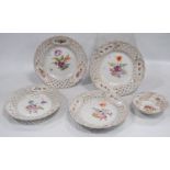 Set of four continental porcelain fruit plates decorated with colourful floral sprays and pierced