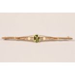 9ct gold peridot and seed pearl bar brooch; 8cm long; gross weight  5.1g