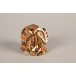 Royal Copenhagen snake paperweight; with gold button; 9cm high