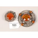 Celtic design orange stone and silver brooch and one other Scottish design brooch (2)
