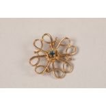 10ct gold brooch set with single stone; gross weight 1.9g
