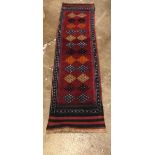 Red ground woolen Middle Eastern runner, 235.5cm x 58.5cm