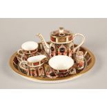 Royal Crown Derby miniature tea service and twin thimbles; tray 20cm wide