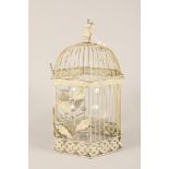 Painted metal ornamental bird cage and a large brandy balloon