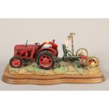 Border Fine Arts model of farmer fixing plough