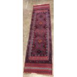 Red ground Middle Eastern runner, 216cm x 59cm