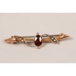 9 carat yellow gold garnet and seed pearl bar brooch; 4.5cm long; gross weight 1.5g