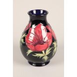 Modern Moorcroft vase; tub lined floral decoration; marks to base; 20cm high