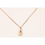 9ct gold chain with a gold simulated tooth pendant; gross weight 14.2g