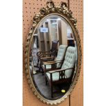 Oval bevel edged gilt hanging wall mirror
