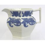 Early Victorian moulded jug of hexagonal baluster form, the white stoneware body with applied