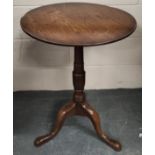 George III circular mahogany occasional table on turned column and downswept tripod supports with