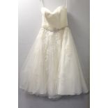 Vintage Romantica short strapless wedding dress with net overlay, beading to waist and applique