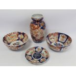 Four pieces of late 19th century Japanese Imari porcelain comprising: ribbed baluster vase decorated