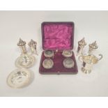 Set of four silver pepperettes, a pair of Armada Dishes, 87mm and four salts, cased, 332g / 10oz.