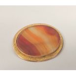Victorian oval chalcedony brooch in engraved gold '9ct', 47mm. 14g gross
