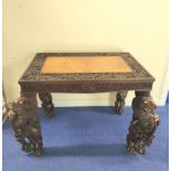 19th century Burmese carved hardwood hall table, the rectangular top with border and frieze of