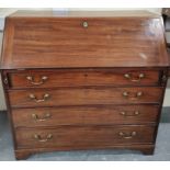 Early 19th century mahogany bureau, the fall front enclosing fitted interior with conch shell oval